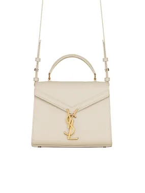 Cassandra Mini Top Handle Bag In Grain De Poudre Embossed Leather