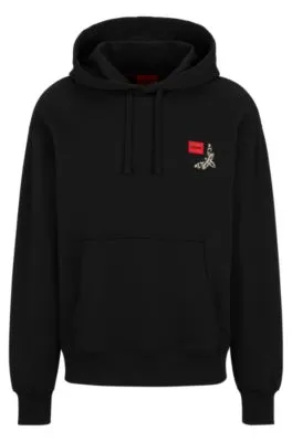 Cotton-terry hoodie with logo label and seasonal artwork