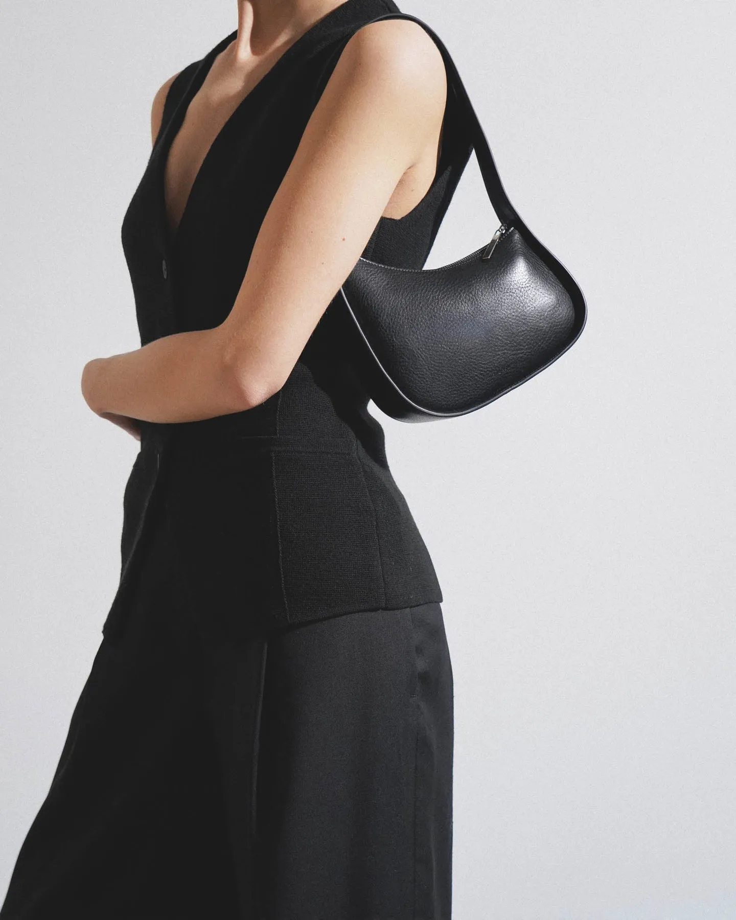 The Row Half moon black leather bag